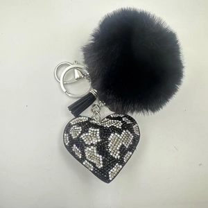 Black leopard print heart keychain with faux fur pom pom and sparkly rhinestone details