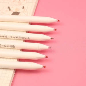 Set of 6 minimalist white retractable gel pens with elegant text on a pink background