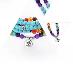 Detail of 108 mala beads bracelet with colorful natural stones and alloy Om charm