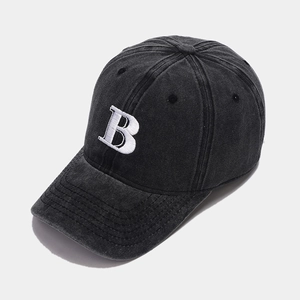 Close-up of charcoal grey washed cotton baseball cap with white 3D letter B embroidery