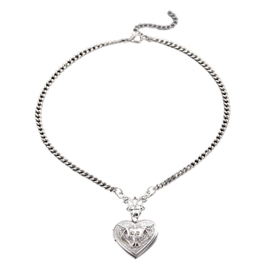 Vintage silver heart locket necklace with intricate butterfly wing engravings on white background