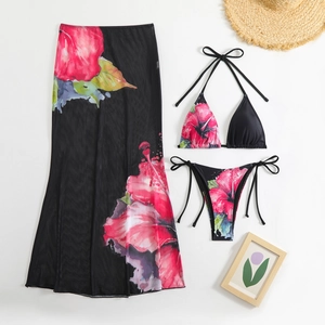 Detailed close-up of tropical floral pattern on mesh cover-up and bikini beachwear set
