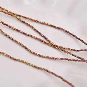 Macro shot of 2mm bronze square hematite beads for DIY jewelry making and necklaces