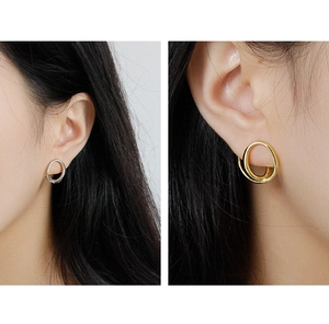 Detailed view of irregular minimalist S925 silver double hoop earrings in gold and silver