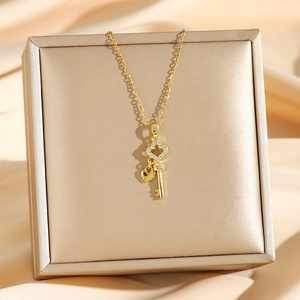 Sparkling key pendant necklace with full zircon and heart charm on a gold chain