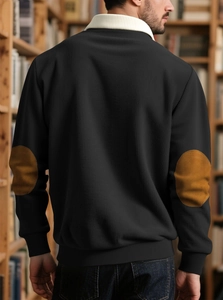 Detailed back view of men's black corduroy sweatshirt with brown suede elbow patches