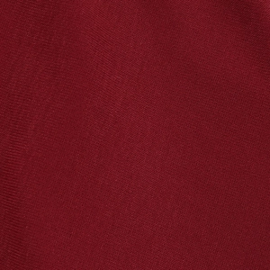 Detailed macro view of the premium burgundy ribbed knit fabric with soft texture