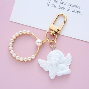 Baroque cupid angel keychain with golden metal ring and white pearl heart embellishments