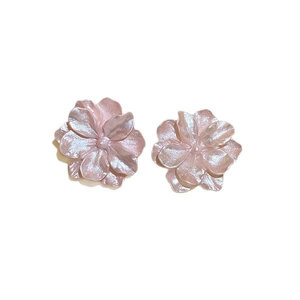 Pink floral stud earrings with pearlescent petals and a minimalist forest style design