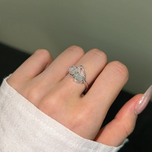Close-up of Toi et Moi double pear-cut zircon ring in silver finish on hand