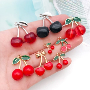 DIY cherry pendants in red and black enamel for handmade bracelets and necklaces