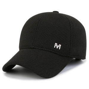Winter men's black baseball cap with plush lining and silver metal sport logo detail