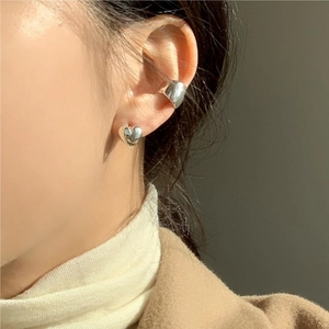 Minimalist 925 sterling silver heart stud earring and ear cuff on female model