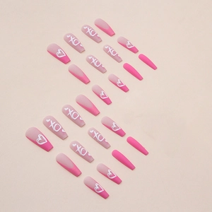 Long coffin press-on nails featuring rose pink glitter and white XO heart designs