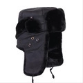 Detail view of black winter Ushanka hat featuring thick faux fur lining and ear flaps