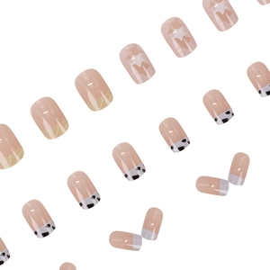 Short square press-on nails with cow print, stars, and wave patterns in a 24-piece set