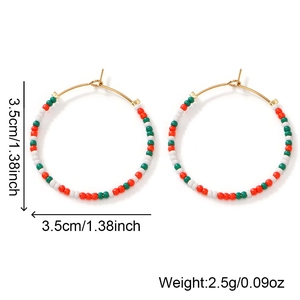 Detail view of colorful bohemian beaded hoop earrings with size 3.5cm and weight 2.5g