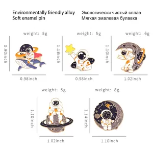 5-piece set of astronaut and whale enamel pins in blue and white colors with measurements