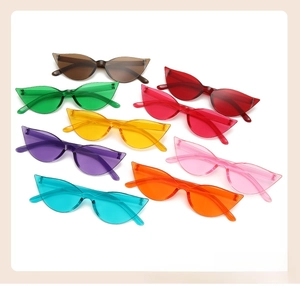 Flat lay of vintage cat eye sunglasses in eight vibrant transparent candy colors