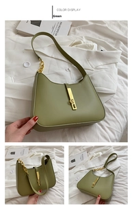 Detail view of sage green hobo bag with gold metal clasp and matte leather texture