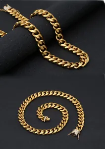 Macro detail of gold Cuban link chain showing the crystal-encrusted secure clasp