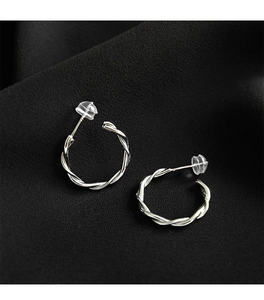 Close-up of S925 silver rope twist hoop earrings with clear silicone safety backs