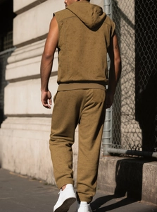 Detail of camel sleeveless hoodie and drawstring joggers set with knitted texture