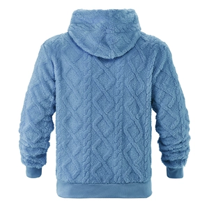 Detail of blue oversized hoodie featuring premium cable knit texture and fleece lining