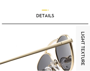 Detail of sleek gold metal frame sunglasses with dark lenses and soft nose pads