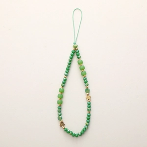 Handmade beaded phone charm with green crystal stones and gold flower accents