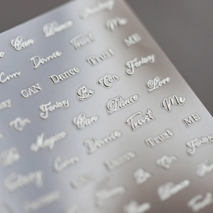 Silver 3D embossed nail art stickers with metallic English words like Love and Fantasy