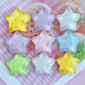 Colorful glittery resin star charms in pastel shades for DIY phone cases and hair clips