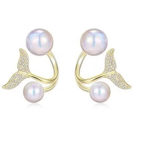 Detailed view of gold fishtail earrings featuring white pearls and shimmering crystals