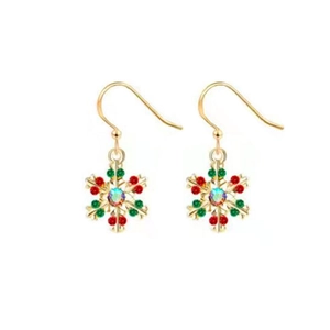 Detail view of festive gold snowflake drop earrings with red, green and iridescent stones