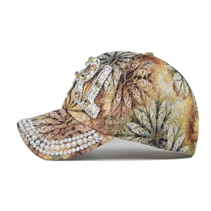 Floral print baseball cap featuring crystal 21 logo and pearl-embellished brim