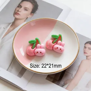 Macro detail of 22x21mm pink resin cherry rabbit charm for DIY craft accessories