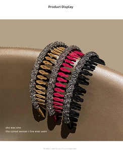 Detailed view of banana hair clips with sparkling rhinestones in black, gold, and pink