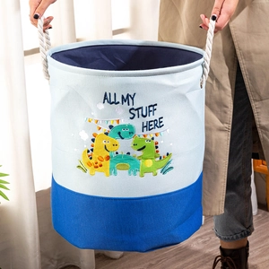 Detail of canvas toy organizer with dinosaur embroidery and sturdy carrying handles