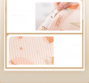 Detail of thickened laundry mesh bag showing zipper protection and floral print pattern