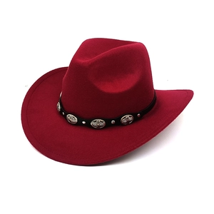 Detail of burgundy wool cowboy hat featuring black leather band and silver metal conchos