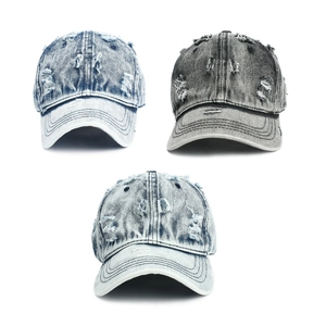 Set of distressed washed denim baseball caps featuring ripped details in American retro style