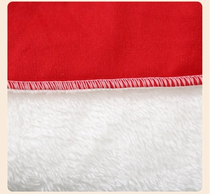 Detail of red knit fabric and white faux fur trim with visible stitching on Christmas hat
