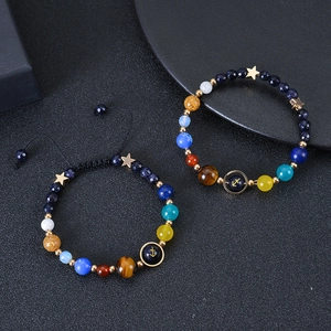 Handcrafted solar system beaded bracelets featuring blue goldstone and planetary stone beads