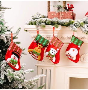 Set of four plush Christmas stockings with 3D Santa, deer, bear, and snowman hanging decor