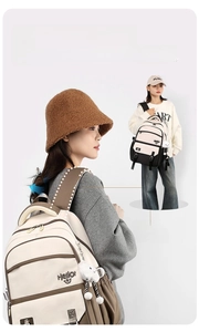Detail of wide ergonomic curved shoulder straps on beige and brown casual backpack