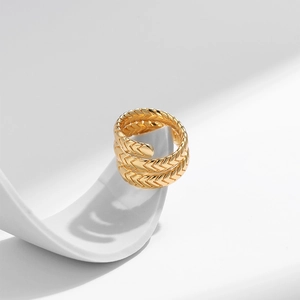 Detailed macro view of 18K gold plated snake ring with scale textures and teardrop design