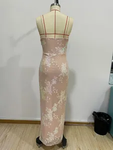 Detail of pink sequin floral embroidery on a backless evening dress with mesh texture