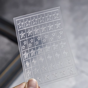 Transparent nail stencil sheet featuring star and diamond patterns with model F-4 marking