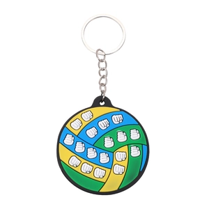 Custom PVC keychain with white fist emblem and vibrant green, yellow, and black color scheme