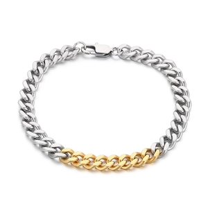 Polished silver and gold two-tone stainless steel Cuban link chain bracelet with lobster clasp
